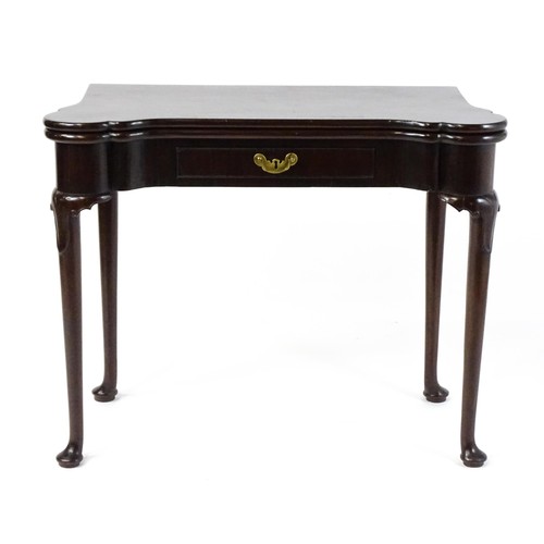 1738 - An 18thC mahogany card table with a castellated hinged top above a single frieze drawer. The table r... 