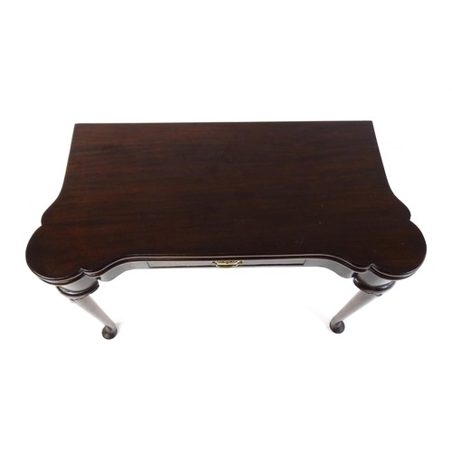 1738 - An 18thC mahogany card table with a castellated hinged top above a single frieze drawer. The table r... 