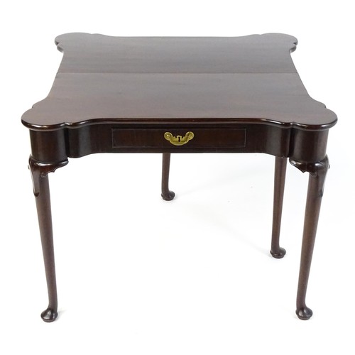 1738 - An 18thC mahogany card table with a castellated hinged top above a single frieze drawer. The table r... 