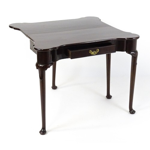 1738 - An 18thC mahogany card table with a castellated hinged top above a single frieze drawer. The table r... 