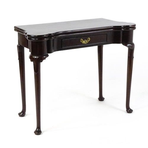 1738 - An 18thC mahogany card table with a castellated hinged top above a single frieze drawer. The table r... 