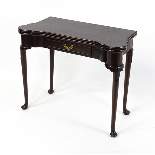 1738 - An 18thC mahogany card table with a castellated hinged top above a single frieze drawer. The table r... 