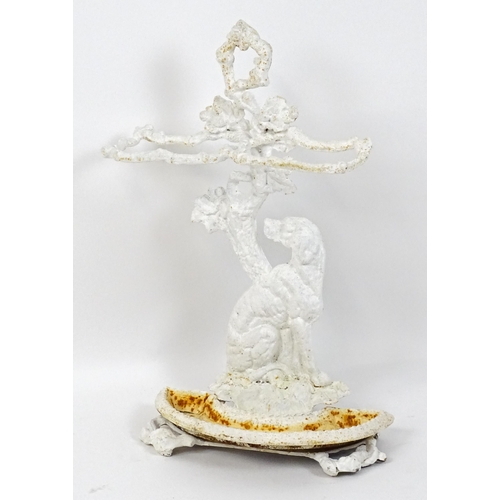 1476 - A Victorian cast iron stick stand with two sections above a dog sitting on the base. 28