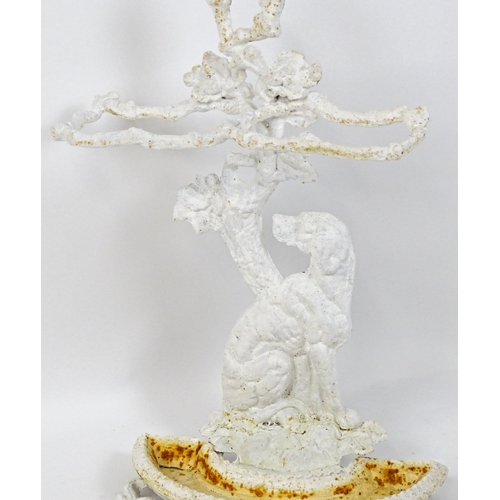 1476 - A Victorian cast iron stick stand with two sections above a dog sitting on the base. 28