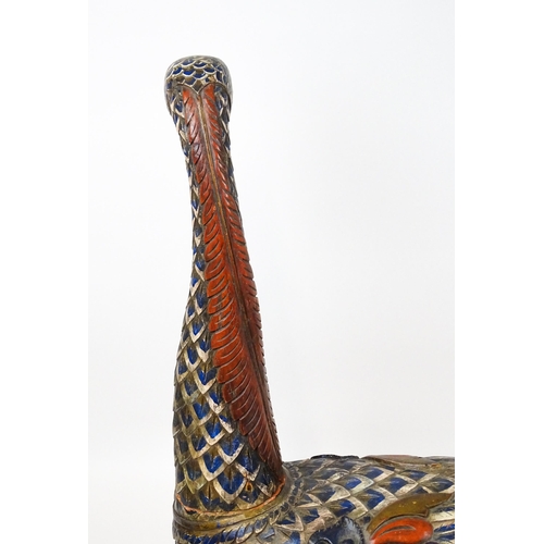 1576 - A very large 20thC carved wooden model of a goose with polychrome decoration. Approx. 50