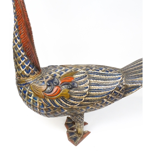 1576 - A very large 20thC carved wooden model of a goose with polychrome decoration. Approx. 50