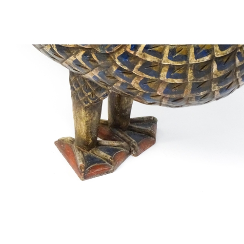 1576 - A very large 20thC carved wooden model of a goose with polychrome decoration. Approx. 50