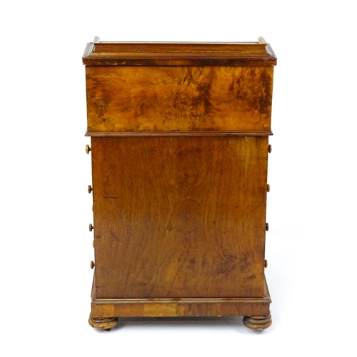 1709 - A late 19thC walnut piano top, pop up Davenport. The sprung top opening to show three short drawers ... 