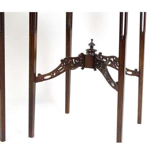 1711 - A pair of 19thC mahogany Chinese Chippendale side tables with pierced upstands above pierced apron b... 