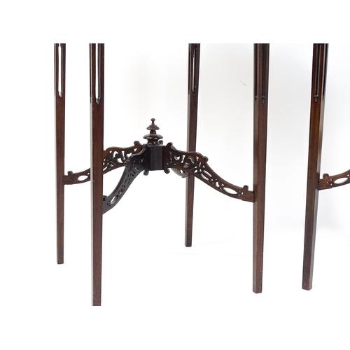 1711 - A pair of 19thC mahogany Chinese Chippendale side tables with pierced upstands above pierced apron b... 