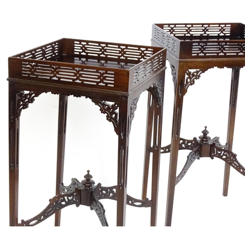 1711 - A pair of 19thC mahogany Chinese Chippendale side tables with pierced upstands above pierced apron b... 