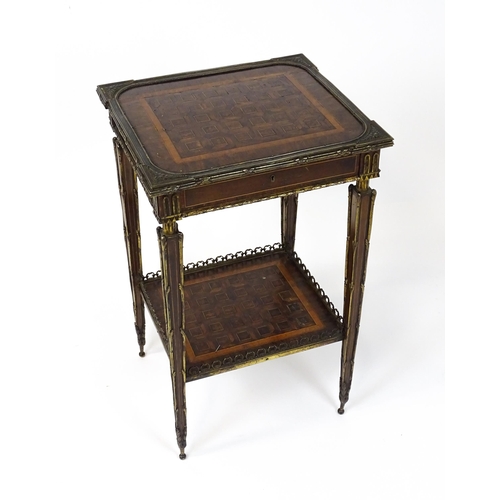 1712 - A 19thC marquetry inlaid side table with moulded metal mounts, a crossbanded top with marquetry inla... 