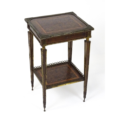 1712 - A 19thC marquetry inlaid side table with moulded metal mounts, a crossbanded top with marquetry inla... 