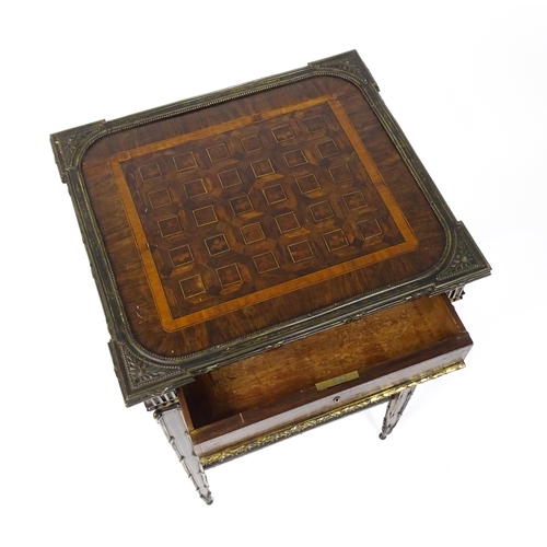 1712 - A 19thC marquetry inlaid side table with moulded metal mounts, a crossbanded top with marquetry inla... 