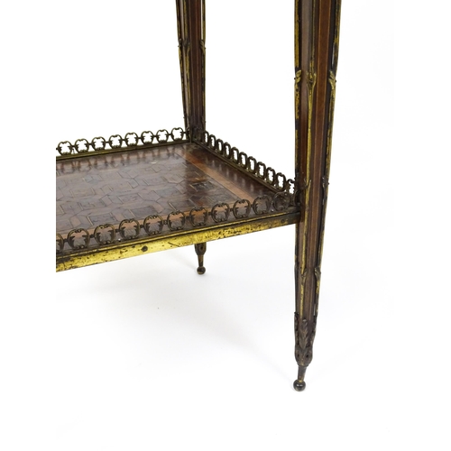 1712 - A 19thC marquetry inlaid side table with moulded metal mounts, a crossbanded top with marquetry inla... 