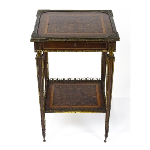 1712 - A 19thC marquetry inlaid side table with moulded metal mounts, a crossbanded top with marquetry inla... 