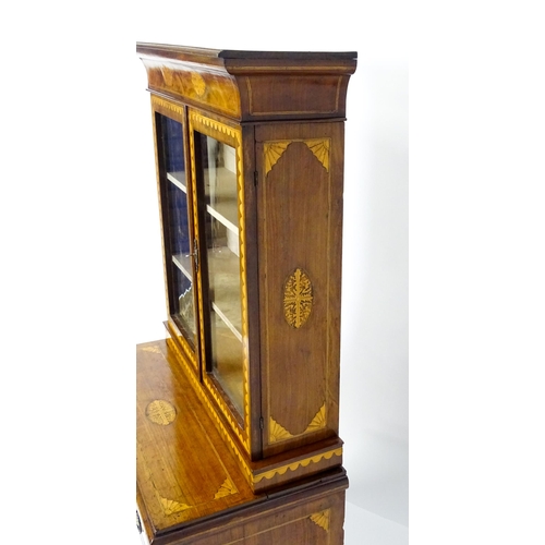 1715 - A 19thC mahogany glazed top bookcase with a moulded cornice above two glazed doors, the super struct... 