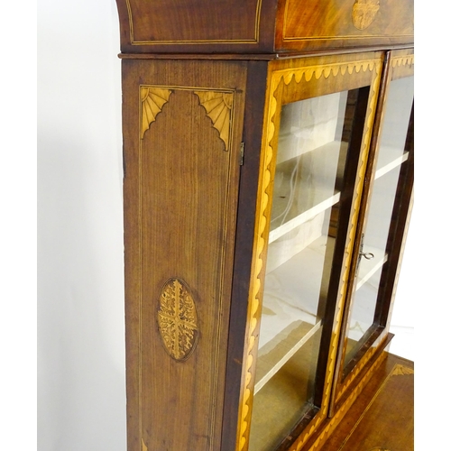 1715 - A 19thC mahogany glazed top bookcase with a moulded cornice above two glazed doors, the super struct... 