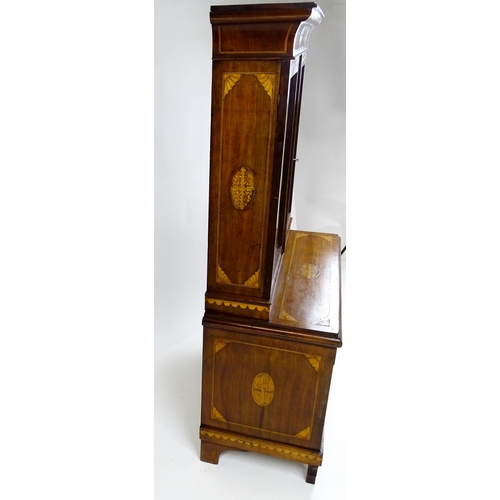 1715 - A 19thC mahogany glazed top bookcase with a moulded cornice above two glazed doors, the super struct... 