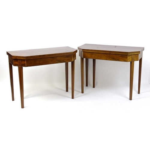 1716 - A pair of George III mahogany card tables with canted corners and raised on straight tapering legs. ... 