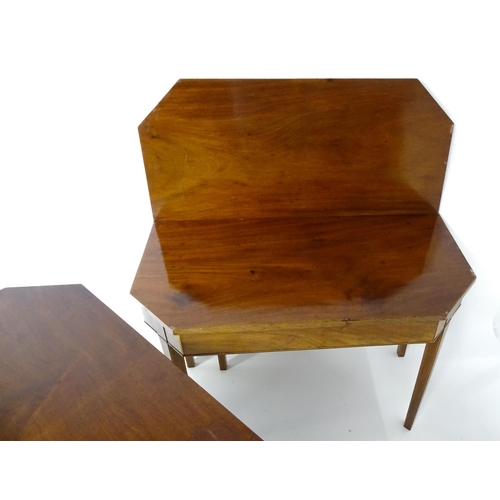 1716 - A pair of George III mahogany card tables with canted corners and raised on straight tapering legs. ... 