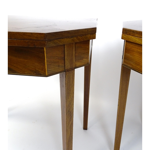 1716 - A pair of George III mahogany card tables with canted corners and raised on straight tapering legs. ... 