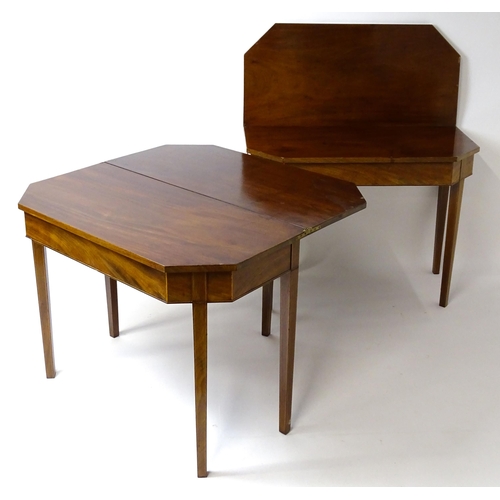 1716 - A pair of George III mahogany card tables with canted corners and raised on straight tapering legs. ... 