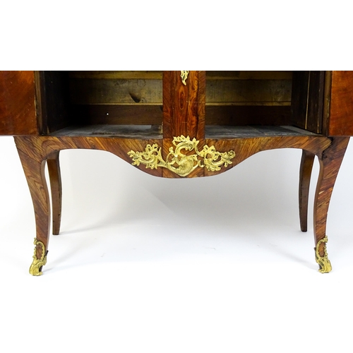 1717 - A late 19thC kingwood bombe commode with a serpentine front. The cabinet produced by the late 19thC ... 