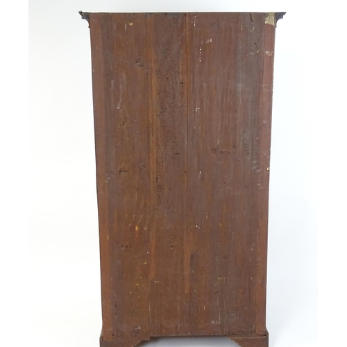 1718 - A Georgian mahogany tall boy / chest of drawers with a moulded cornice above a dentil carved frieze ... 