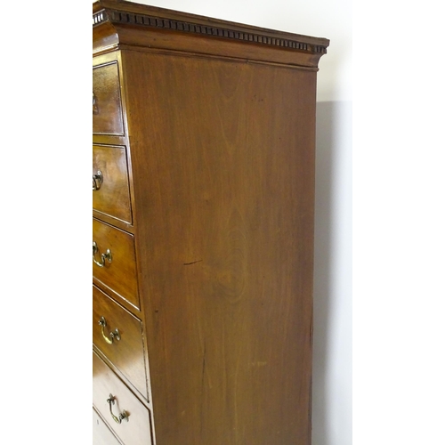 1718 - A Georgian mahogany tall boy / chest of drawers with a moulded cornice above a dentil carved frieze ... 