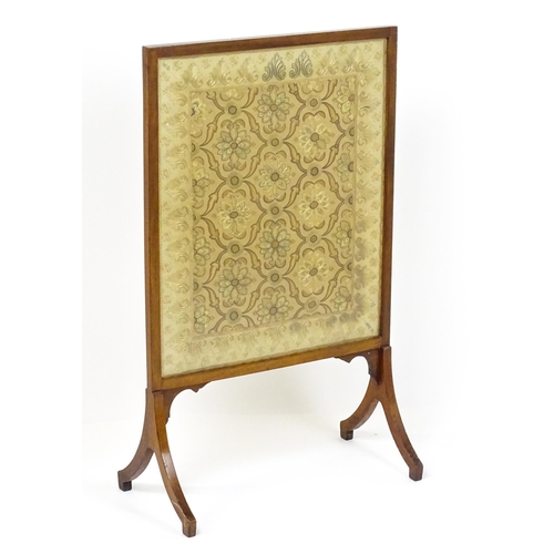 1737 - A late 19thC needlework fire screen raised on four shaped legs. 23