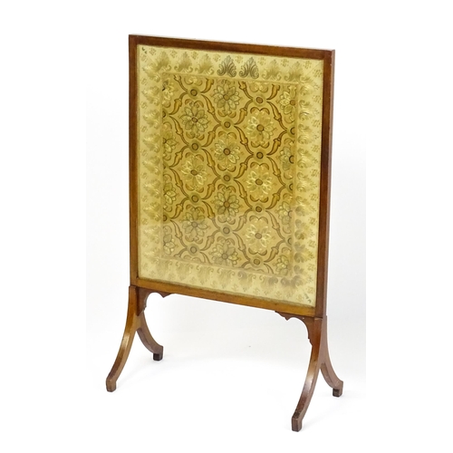 1737 - A late 19thC needlework fire screen raised on four shaped legs. 23