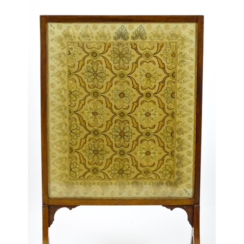 1737 - A late 19thC needlework fire screen raised on four shaped legs. 23