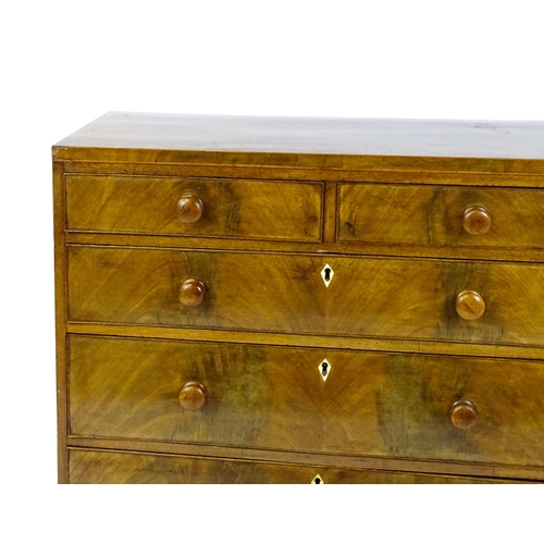 1740 - A Georgian mahogany chest of drawers with two short drawers over three long drawers with diamond sha... 