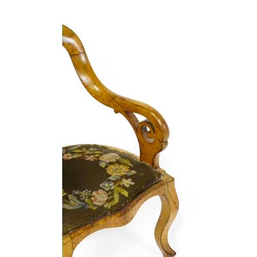 1741 - A late 19thC walnut child's chair with a bowed backrest above a pierced back splat and raised on cab... 