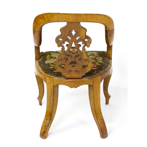 1741 - A late 19thC walnut child's chair with a bowed backrest above a pierced back splat and raised on cab... 