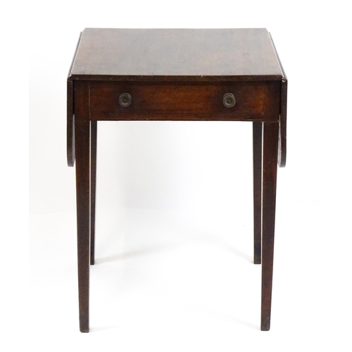 1742 - A Georgian mahogany drop flap table with a single frieze drawer above four tapering legs. 22