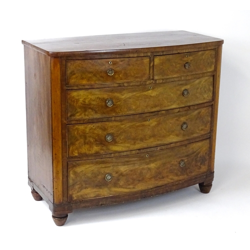 1743 - A 19thC mahogany bow fronted chest of drawers comprising two short over three long graduated drawers... 