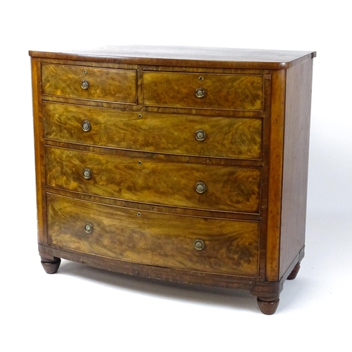 1743 - A 19thC mahogany bow fronted chest of drawers comprising two short over three long graduated drawers... 