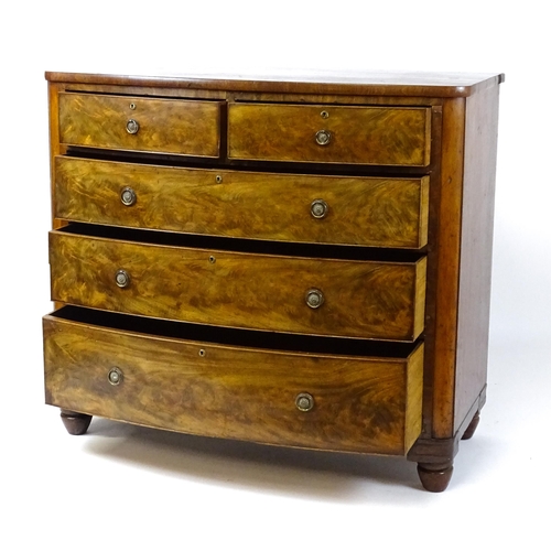 1743 - A 19thC mahogany bow fronted chest of drawers comprising two short over three long graduated drawers... 