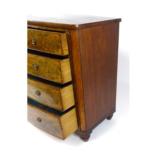 1743 - A 19thC mahogany bow fronted chest of drawers comprising two short over three long graduated drawers... 