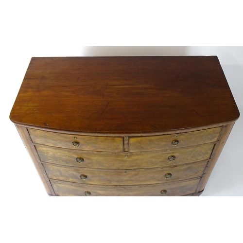 1743 - A 19thC mahogany bow fronted chest of drawers comprising two short over three long graduated drawers... 