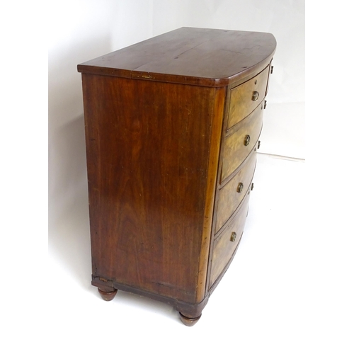 1743 - A 19thC mahogany bow fronted chest of drawers comprising two short over three long graduated drawers... 