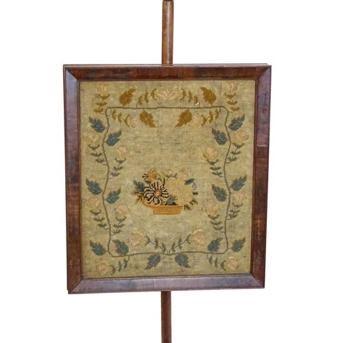 1750 - A late 19thC mahogany pole screen with a needlework panel above a turned stem and a stepped base. 53... 