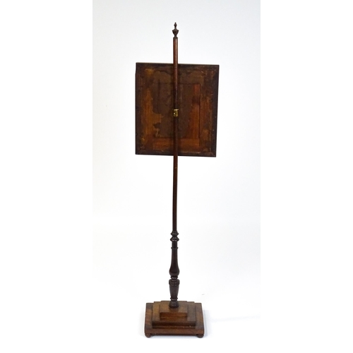 1750 - A late 19thC mahogany pole screen with a needlework panel above a turned stem and a stepped base. 53... 