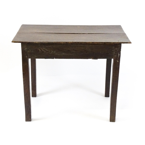 1754 - A Georgian oak side table with a single frieze drawer above a two plank top, single frieze drawer an... 