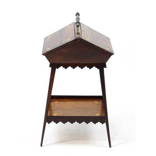 1755 - A 19thC rosewood sewing table with a carrying handle above two hinged lids with satinwood marquetry ... 