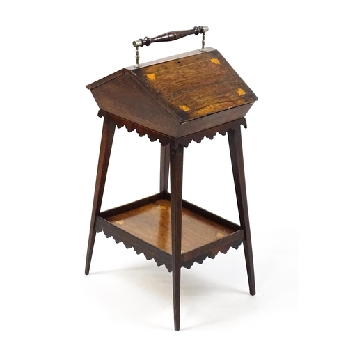 1755 - A 19thC rosewood sewing table with a carrying handle above two hinged lids with satinwood marquetry ... 