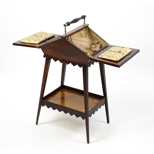 1755 - A 19thC rosewood sewing table with a carrying handle above two hinged lids with satinwood marquetry ... 