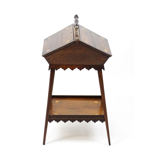 1755 - A 19thC rosewood sewing table with a carrying handle above two hinged lids with satinwood marquetry ... 